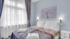 Tempat tidur dalam kamar di Aphrodite Suite Hotel Karlovy Vary