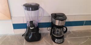 a blender and a coffee maker sitting on a counter at Beautiful Home on Sunny Acreage in Lunenburg