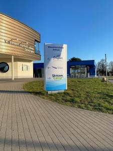 a sign outside of a building in front of a building at StroamCamp Schwedt - a84456 in Schwedt