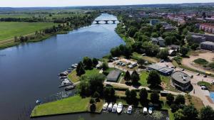 an aerial view of a river with boats in the water at StroamCamp Schwedt - a84456 in Schwedt