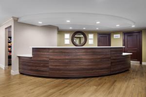 a salon with a wooden bar in a room at Residence Inn Hartford Rocky Hill in Rocky Hill