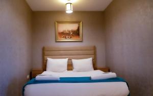 Cama ou camas em um quarto em Bursa Suites Apart Otel