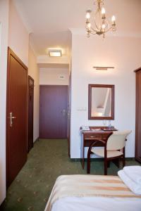 Кровать или кровати в номере Hotel Masovia