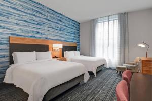 Krevet ili kreveti u jedinici u objektu TownePlace Suites by Marriott Cincinnati Downtown