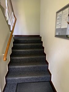 a stairwell in a building with a stair case at Ferienwohnung in Bern in Bern