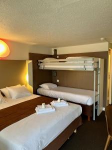 a hotel room with two bunk beds in it at Campanile Troyes Sud - Buchères in Troyes