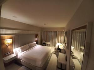 Giường trong phòng chung tại Gran Talaso Hotel Sanxenxo