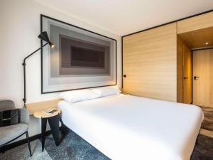 Кровать или кровати в номере ibis Nancy Centre Stanislas