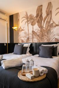 Tempat tidur dalam kamar di Hôtel Gallia Cannes