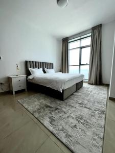 A bed or beds in a room at Luxury full sea view flat