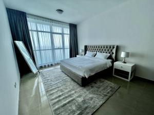 A bed or beds in a room at Luxury full sea view flat