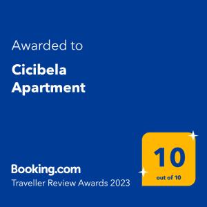 a yellow sign with the words awarded to gilaala appointment at Cicibela Apartment - Zadar in Zadar