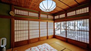 Una cama o camas en una habitación de 富士吉田かつまたや