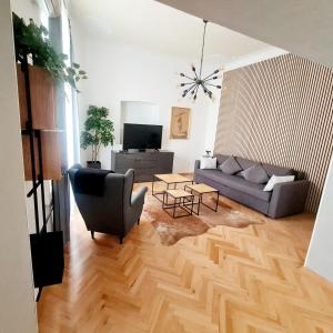 a living room with a couch and a table at Cicibela Apartment - Zadar in Zadar