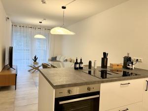 a kitchen with a counter top and a living room at Moselblick II ad Reichsburg Parkplatz 100m Marktplatz in Cochem