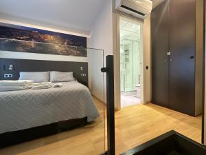 Cama ou camas em um quarto em Precioso dúplex en el centro de Tarragona