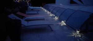 a row of chairs with lights in the dark at Le PATSA de Vouillé in Vouillé