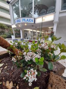 a building with a sign that reads rental plaza at Hotel Royal Plaza in Rimini