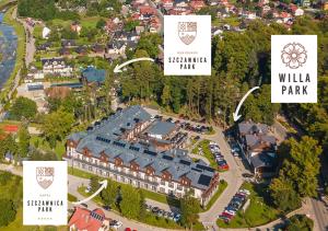 eine Luftansicht eines Gebäudes mit Park in der Unterkunft Szczawnica Park Resort & Spa in Szczawnica