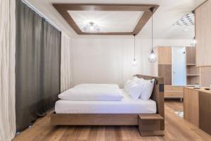 Una cama o camas en una habitación de Hotel Tofana