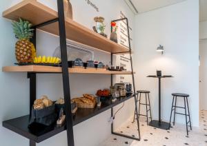 A kitchen or kitchenette at d'ALMA Boutique Hotel