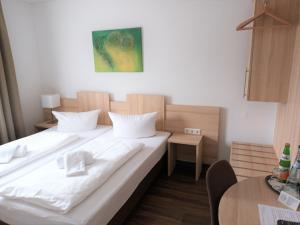 Voodi või voodid majutusasutuse Hotel Zum Prinzen Sinsheim toas