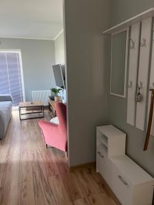 Μια τηλεόραση ή/και κέντρο ψυχαγωγίας στο Cosy Apartment-Marine