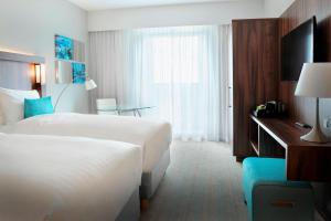 Tempat tidur dalam kamar di Courtyard by Marriott Amsterdam Arena Atlas