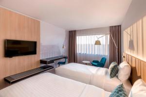 Tempat tidur dalam kamar di Courtyard by Marriott Brno