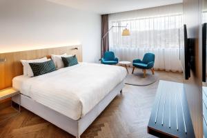 Tempat tidur dalam kamar di Courtyard by Marriott Brno