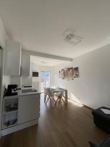 A kitchen or kitchenette at Settimo Cielo Apartment Aosta CIR 0199