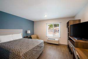 Krevet ili kreveti u jedinici u okviru objekta WoodSpring Suites Austin Central