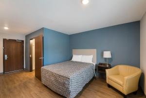 Krevet ili kreveti u jedinici u okviru objekta WoodSpring Suites Austin Central