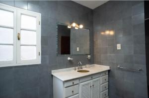 a bathroom with a sink and a mirror at Casa Salta in Salta