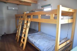 Una cama o camas en una habitación de 伯方plus+