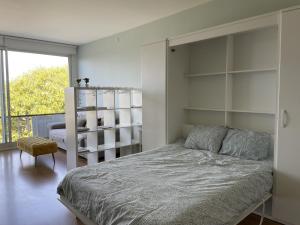 Una cama o camas en una habitación de Rua das Arcadas do Parque 52