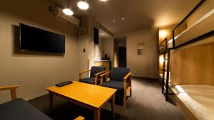 A television and/or entertainment centre at ALPHABED INN Fukuoka Ohori Park