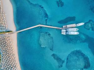 an aerial view of a boat in the ocean at Jaz Makadi Saraya Resort in Hurghada