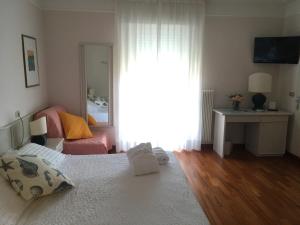 Una cama o camas en una habitación de Hotel Abbazia