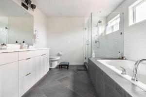 A bathroom at Comfy Family Home, Walkable Neighborhood + Patio!