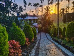 Jardí fora de CentreHome Villa Wayanad