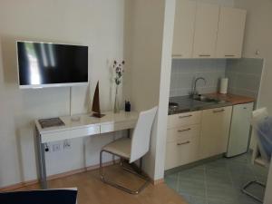 A cozinha ou cozinha compacta de New Studio Apartments Trlaja