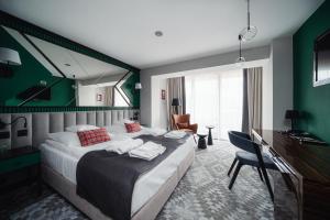 Cama ou camas em um quarto em Rysy Boutique Hotel