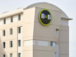 a building with a bbc hotel sign on it at B&B HOTEL Paris Roissy CDG Aéroport in Roissy-en-France