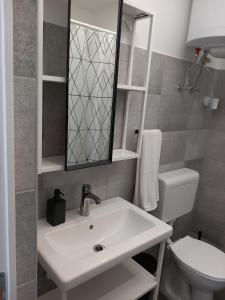 Bathroom sa Gemini Apartman