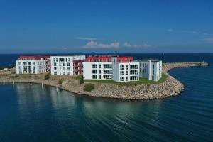 a group of buildings on an island in the water at Fewo 3-13 Ostsee in Kappeln