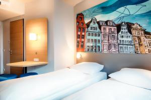 B&B Hotel Rostock City-West में एक कमरे में एक या कई बेड