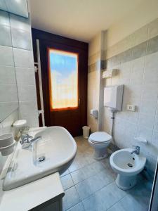 Un baño de Elga Residence - Relax in Alta Valtellina - Bormio