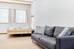 a living room with a couch and a coffee table at Pension Barborka in Boží Dar