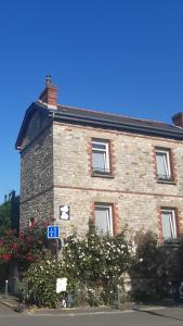 a brick building with a sign in front of it at Ker Karantez in Rennes